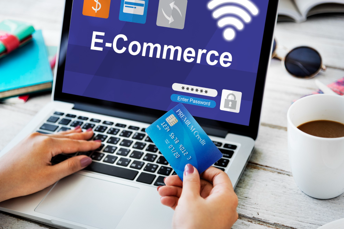 Shopper paying for an online order with a card on a laptop