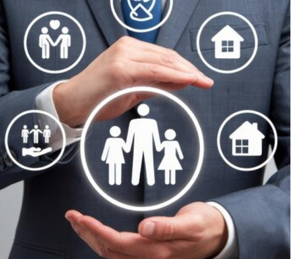 Agent holding icons of homes and families representing property services