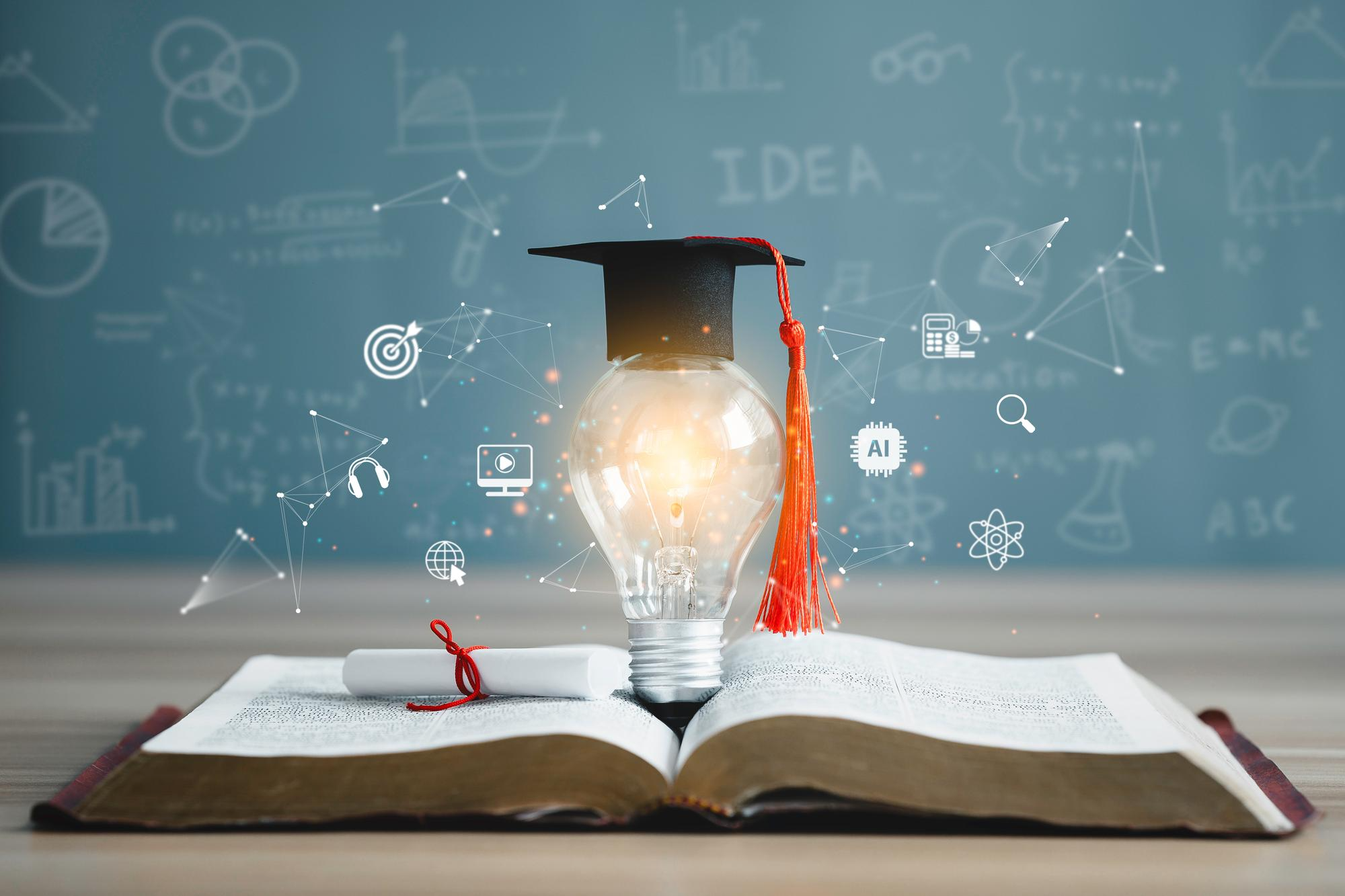 Open book with a graduation cap and learning icons