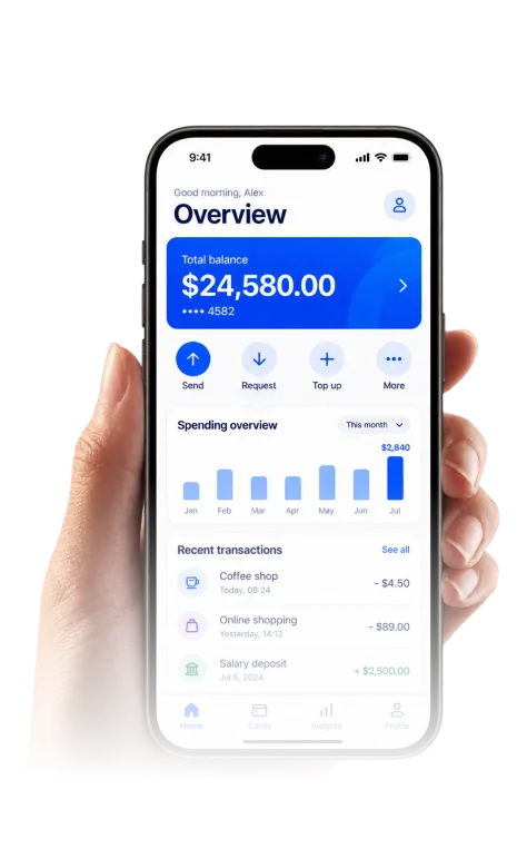Hand holding a phone with a fintech app overview screen